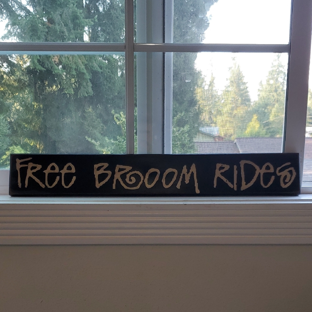 Free Broom Rides Sign